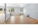 Spacious open-concept living area with wood-look floors, neutral paint, and ample natural light at 729 Golden Horseshoe Ln, Sanford, NC 27330