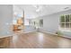Bright living room with wood-look floors, neutral walls, and plenty of natural light at 729 Golden Horseshoe Ln, Sanford, NC 27330