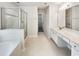 Large bathroom with double sink vanity, soaking tub and walk-in shower at 7425 Silver View Ln, Raleigh, NC 27613