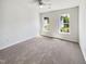 Bright bedroom with plush carpet, natural light and neutral walls at 7425 Silver View Ln, Raleigh, NC 27613