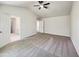 Large primary bedroom with vaulted ceiling and ensuite bathroom at 7425 Silver View Ln, Raleigh, NC 27613