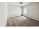 A comfortable bedroom with soft carpet, a ceiling fan, and a window that provides ample natural light at 7425 Silver View Ln, Raleigh, NC 27613