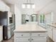 Kitchen with an island and stainless steel appliances overlooks the living room at 7425 Silver View Ln, Raleigh, NC 27613