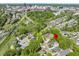 Aerial view of a residential neighborhood with lush green trees and a red marker indicating the property location at 811 Fargo St, Durham, NC 27707
