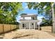 Spacious backyard featuring a covered patio and a newly installed wooden fence at 811 Fargo St, Durham, NC 27707
