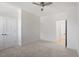 Neutral bedroom includes carpet flooring, a ceiling fan and ensuite bathroom at 811 Fargo St, Durham, NC 27707