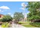 Lush green lawn and water tower create a park-like ambiance, perfect for relaxation and outdoor enjoyment at 811 Fargo St, Durham, NC 27707