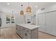 Kitchen with island, pendant lighting and open floor plan leads to dining room and living room at 811 Fargo St, Durham, NC 27707