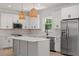 Stylish kitchen featuring a large island, modern appliances, and white cabinetry at 811 Fargo St, Durham, NC 27707