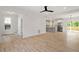 Open-concept living room with hardwood floors leading to dining and kitchen at 811 Fargo St, Durham, NC 27707