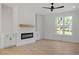 Bright living room with modern fireplace and built-in cabinetry at 811 Fargo St, Durham, NC 27707