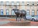 Downtown bronze bull statue with surrounding brick pavers, adding artistic charm to the urban landscape at 811 Fargo St, Durham, NC 27707