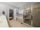 Bathroom featuring a garden tub and shower with glass door plus access to a walk in closet at 85 Rivers Edge Ct, Timberlake, NC 27583