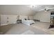 Large bedroom with neutral carpet, sloped ceilings, and natural light offering a serene and comfortable living space at 85 Rivers Edge Ct, Timberlake, NC 27583