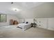Bright bedroom with carpet, sloped ceilings, and natural light, providing a cozy and comfortable living space at 85 Rivers Edge Ct, Timberlake, NC 27583
