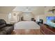 Spacious bonus room with hardwood floors, neutral colors, and ample natural light, perfect for entertainment or a home gym at 85 Rivers Edge Ct, Timberlake, NC 27583