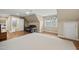 Bright bonus room with hardwood floors, neutral walls, and a comfortable seating area with natural light from large windows at 85 Rivers Edge Ct, Timberlake, NC 27583