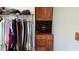 Organized closet with hanging racks and shelving for efficient storage of clothes and shoes at 85 Rivers Edge Ct, Timberlake, NC 27583