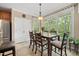Bright dining room with large windows, a chandelier, and a wooden dining table at 85 Rivers Edge Ct, Timberlake, NC 27583