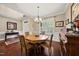 Elegant dining room featuring hardwood floors, shutters and a chandelier at 85 Rivers Edge Ct, Timberlake, NC 27583