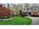 Inviting home with stone accents, shutters and a well-maintained front yard at 85 Rivers Edge Ct, Timberlake, NC 27583