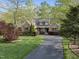 Charming home featuring a landscaped yard and stone accents at 85 Rivers Edge Ct, Timberlake, NC 27583