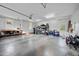 Spacious and organized garage with bright lighting, workbench, and ample storage, perfect for hobbies and vehicles at 85 Rivers Edge Ct, Timberlake, NC 27583