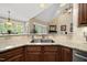 Kitchen sink with stainless steel appliances and granite countertops with natural light at 85 Rivers Edge Ct, Timberlake, NC 27583