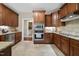 Modern kitchen featuring stainless steel appliances, granite countertops, and ample cabinet space at 85 Rivers Edge Ct, Timberlake, NC 27583