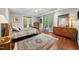 This main bedroom features hardwood floors, natural light, and backyard access at 85 Rivers Edge Ct, Timberlake, NC 27583
