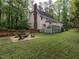 Wide angle of the back of the home showing the fire pit and back deck with covered area at 8805 Stage Ford Rd, Raleigh, NC 27615