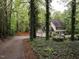 Beautiful home with mature landscaping, and a long driveway for privacy from the main road at 8805 Stage Ford Rd, Raleigh, NC 27615