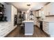 Well-appointed kitchen featuring white cabinetry, stainless appliances, and a breakfast bar at 8805 Stage Ford Rd, Raleigh, NC 27615