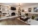 Cozy living room with built-in bookshelves, brick fireplace, and comfortable seating at 8805 Stage Ford Rd, Raleigh, NC 27615