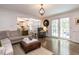 Spacious living room featuring hardwood floors, French doors, and a comfortable seating area at 8805 Stage Ford Rd, Raleigh, NC 27615