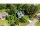 Aerial shot of a home nestled among lush, mature trees and greenery at 9016 New Century Rd, Wake Forest, NC 27587