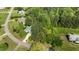 A high angle view of the residence surrounded by mature trees highlighting the landscape and location at 9016 New Century Rd, Wake Forest, NC 27587