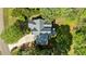 A bird's-eye view of a well-maintained home with mature trees and landscaping, showcasing its location at 9016 New Century Rd, Wake Forest, NC 27587