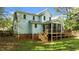 Exterior view of the home and deck with a screened-in porch at 9016 New Century Rd, Wake Forest, NC 27587