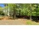 Wide, private parking pad located behind a backyard fence at 9016 New Century Rd, Wake Forest, NC 27587