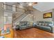 Spacious living room with hardwood floors, a staircase, and comfortable seating offering a cozy atmosphere at 9016 New Century Rd, Wake Forest, NC 27587