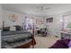 Eclectic bedroom featuring a drum set, vanity, and cozy bed creating a personalized and inviting space at 906 Circle Dr, Creedmoor, NC 27522