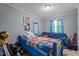 Cozy bedroom with blue accents, featuring unique Paw Patrol-themed bedding and ample space for relaxation and play at 906 Circle Dr, Creedmoor, NC 27522