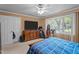 Bright bedroom with a dresser, a large window offering natural light, and a view of the outdoors at 906 Circle Dr, Creedmoor, NC 27522
