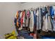 An organized closet filled with a variety of clothing items, offering ample storage space for an efficient wardrobe at 906 Circle Dr, Creedmoor, NC 27522