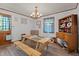 Inviting dining room with rustic wood table, chandelier, and vintage wood hutch at 906 Circle Dr, Creedmoor, NC 27522