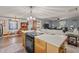 Open floor plan with view from kitchen island to living room and dining areas at 906 Circle Dr, Creedmoor, NC 27522