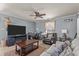 Spacious living room with modern TV, comfortable seating, and desk for work at 906 Circle Dr, Creedmoor, NC 27522