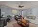 Cozy living room featuring comfortable seating, a ceiling fan, and natural light from the window at 906 Circle Dr, Creedmoor, NC 27522