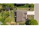 Aerial view of the house showcasing the roof, backyard, deck, and surrounding landscaping at 9212 Linslade Way, Wake Forest, NC 27587